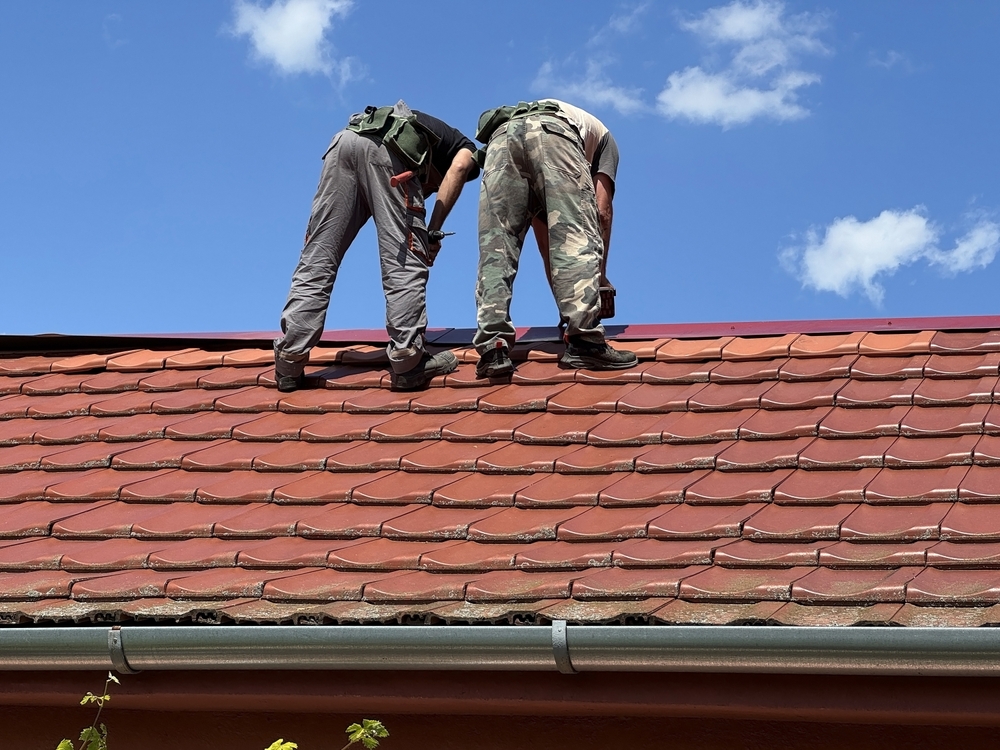 Roofers,Are,Working,On,The,Roof,Of,A,House