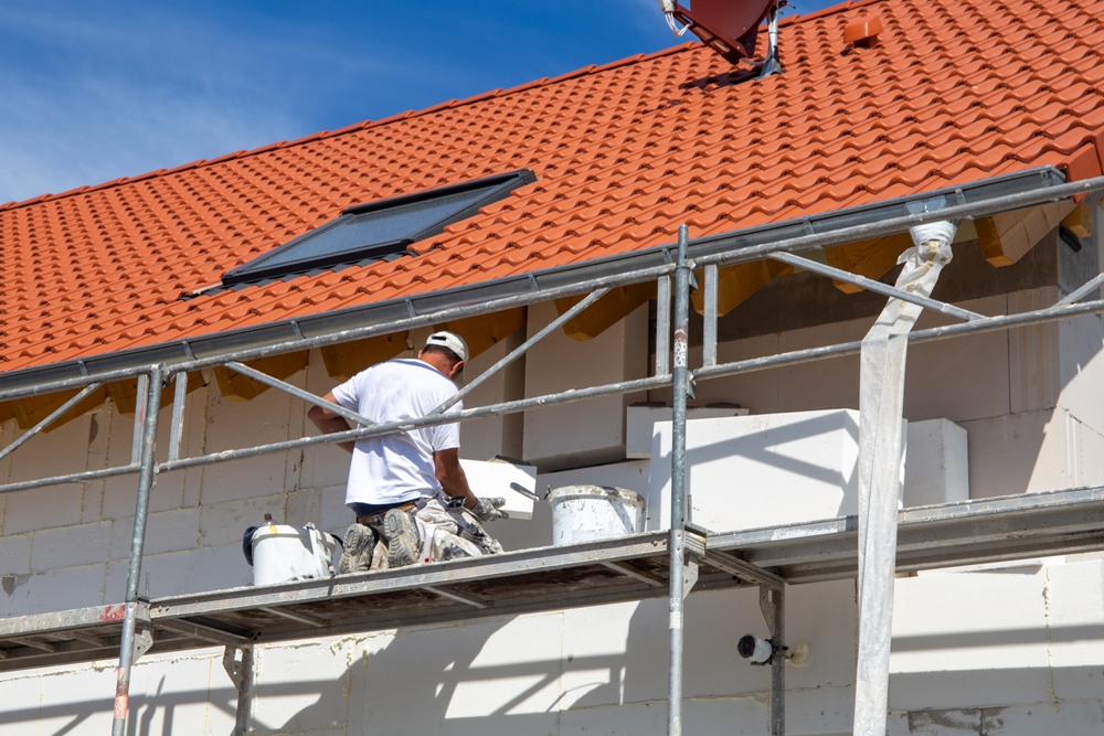 Construction,Workers,Insulates,House,Facade